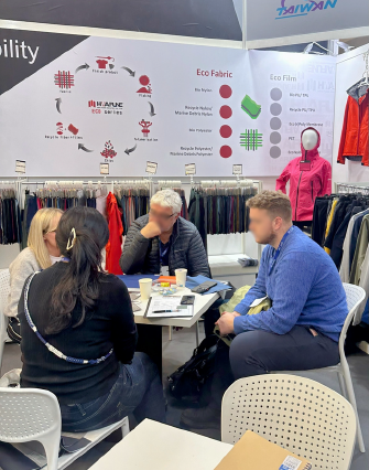 Hwafune Trade Show Exhibition Hwafune team holding meetings with visitors at an international textile trade show